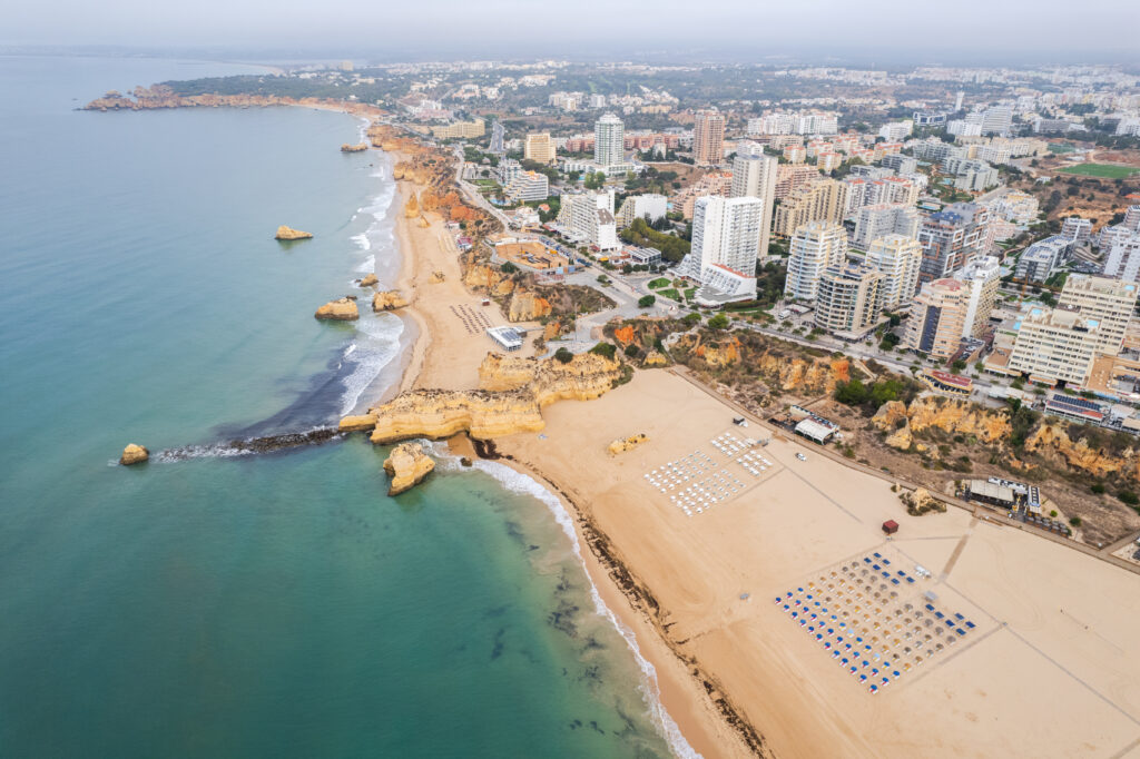 Aerial drone view of Portimao skyline and city beach of Praia da Rocha , Algarve,Portugal