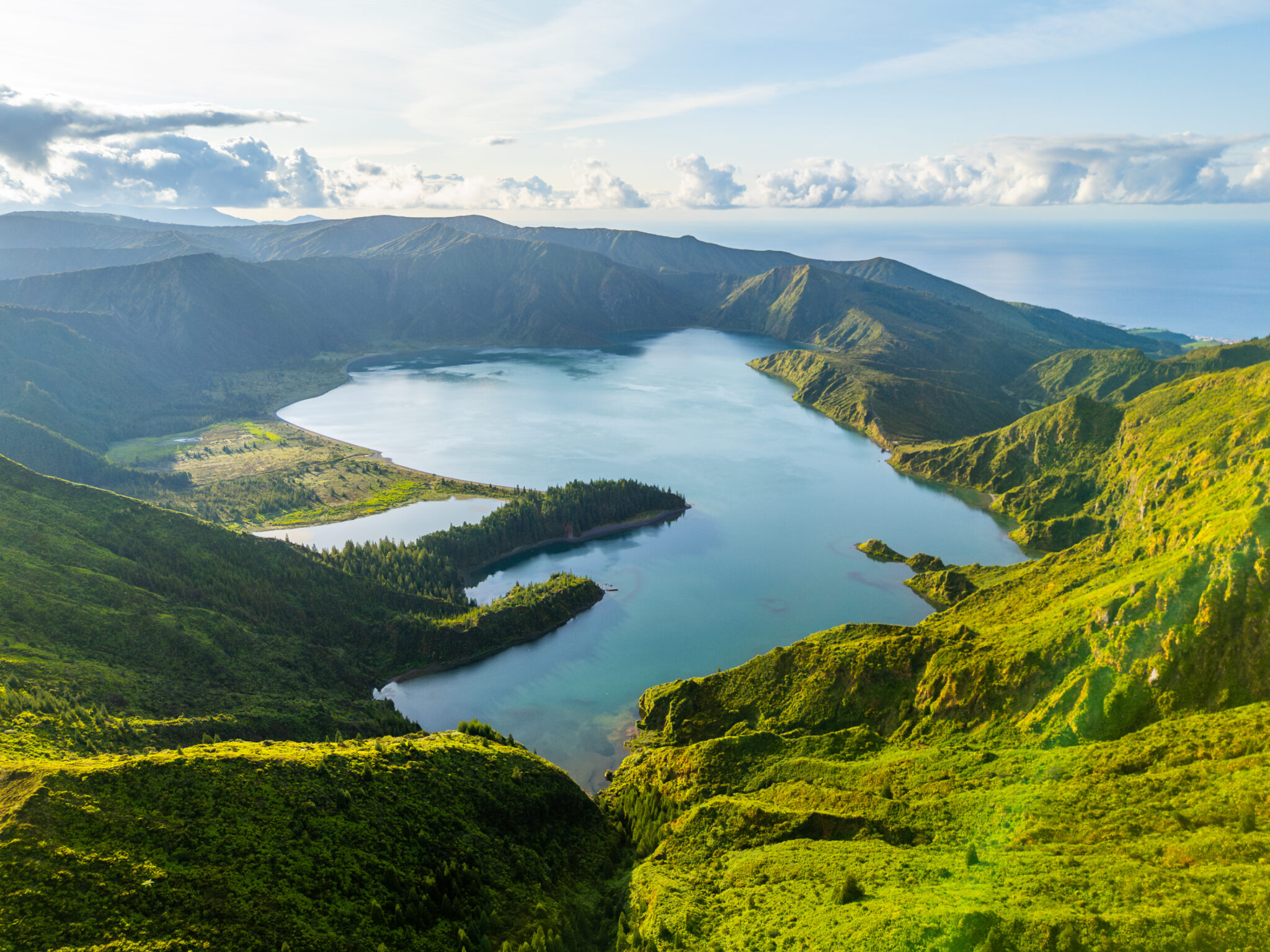 Lagoa do Fogo Crater Lake at Sunrise. Green Lush Hills and Mountains. Azores, Sao Miguel Island. Portugal. Aerial Drone Shot
